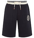 Tommy Hilfiger Stuttbuxur - Monotype Arch Seal - Desert Himinn